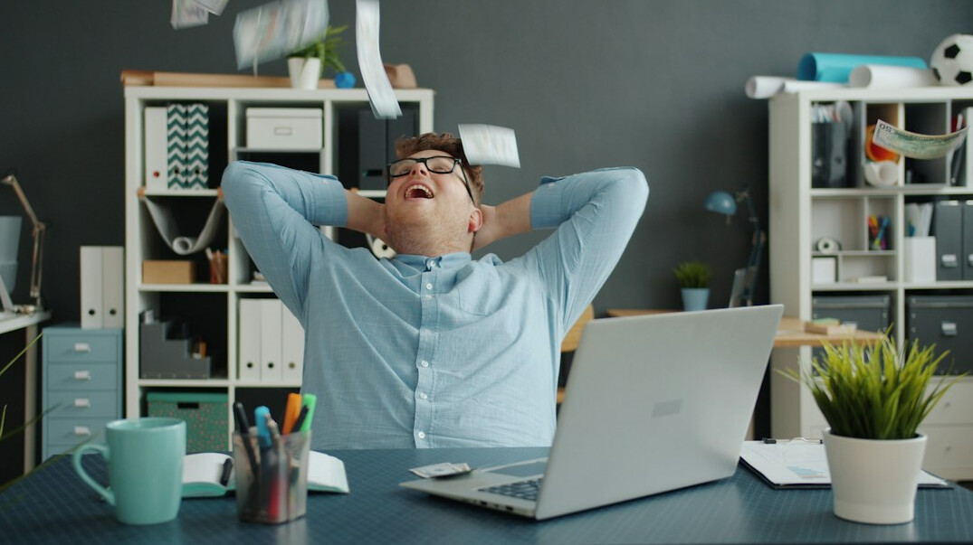 person stretching at desk