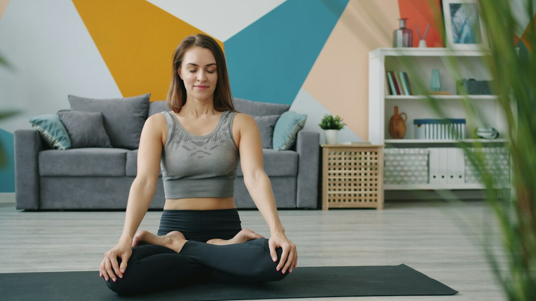 person meditating at home