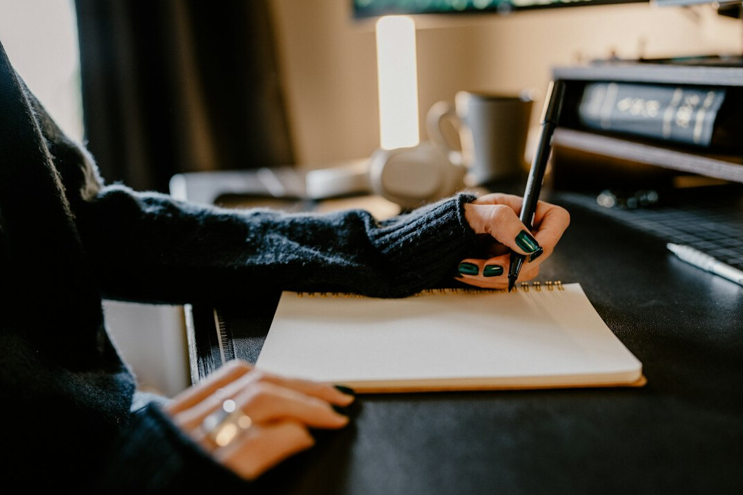 journal writing at desk