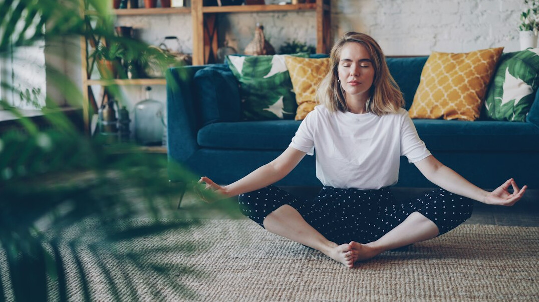 Person meditating peacefully in a calm room